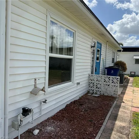 View of side of home featuring a central air condition unit