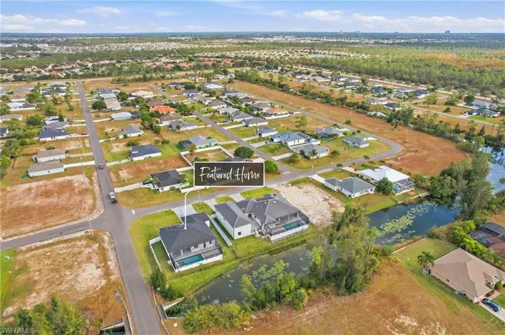 View of property location with nearby suburban area and a nearby body of water