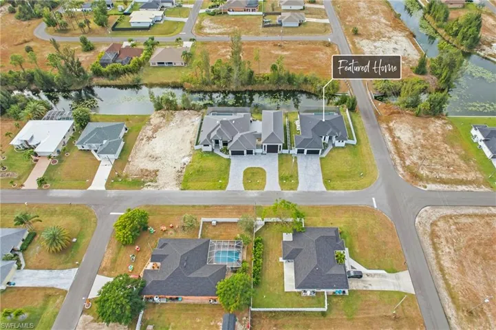 View of property location with nearby suburban area and a large body of water