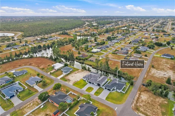 Aerial overview of property's location with nearby suburban area