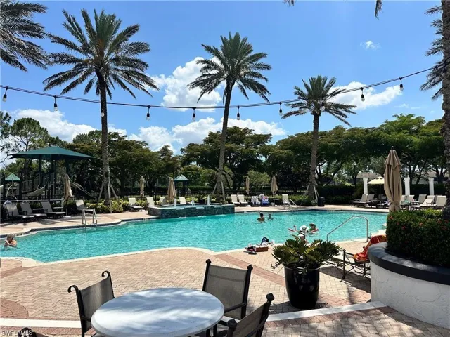 Community pool featuring a patio