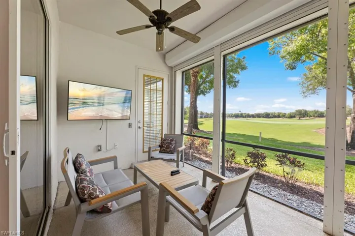 Sunroom featuring ceiling fan