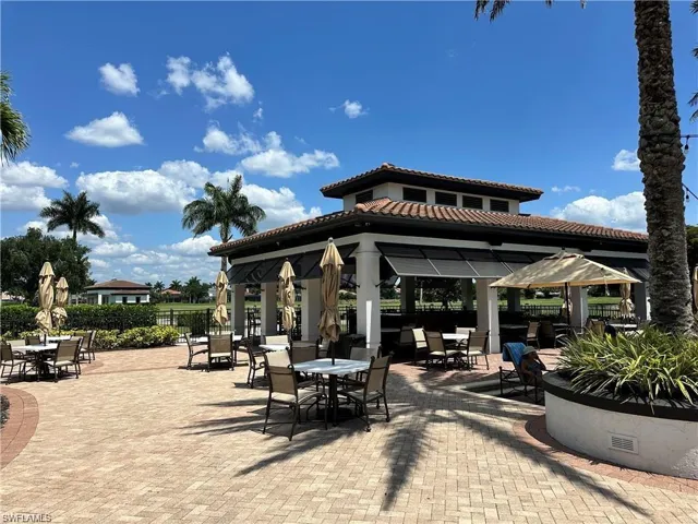 View of patio with a gazebo and outdoor dining space