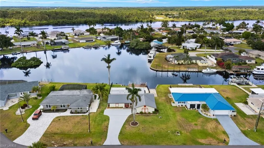 Aerial view of residential area with a nearby body of water
