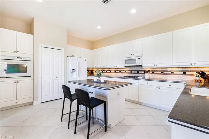 Eat-in kitchen with  oversized tile on the diagonal