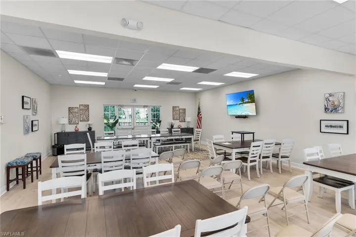 Dining area featuring a drop ceiling and light wood-type flooring