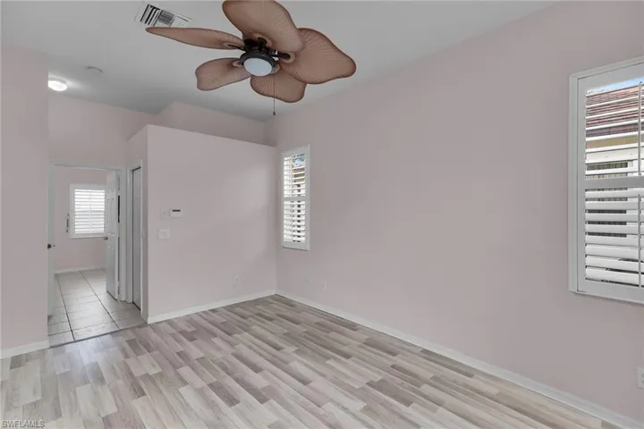 Spare room featuring light wood finished floors and a ceiling fan