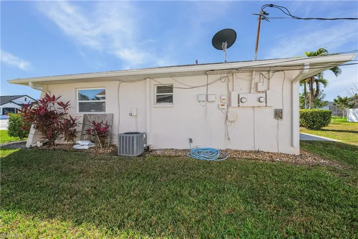 Right side exterior, stucco siding w/ac