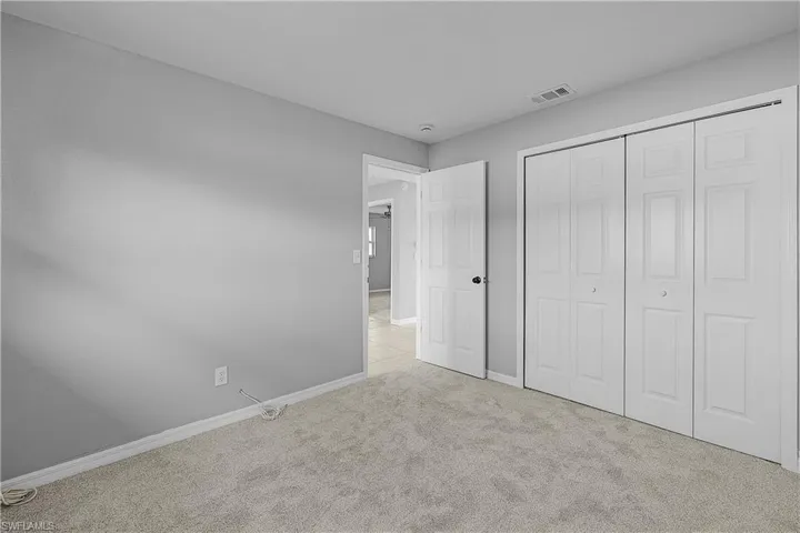 4014(L) Bedroom with new light colored carpet and closet(new doors)