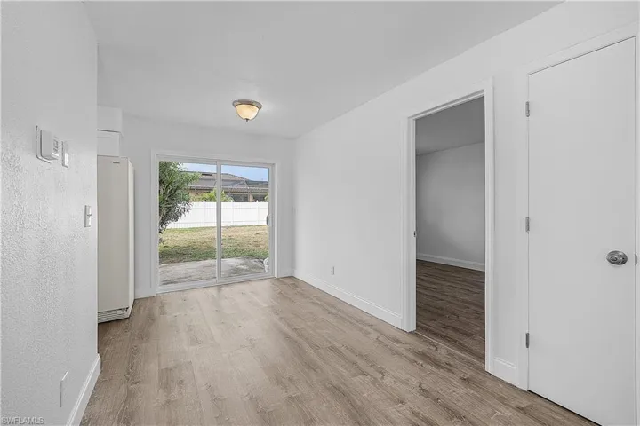 4012(R) Dining area with light LVP wood plank flooring