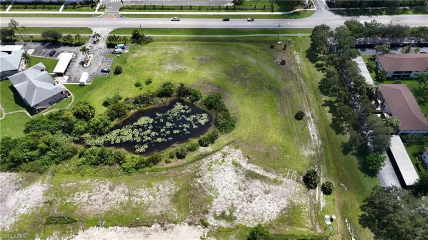 Aerial view of property's location featuring a large body of water