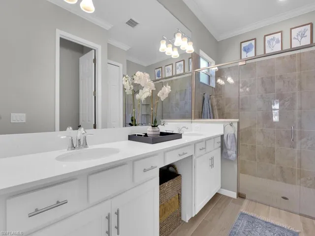 Owners bath with double vanities and large luxurious shower