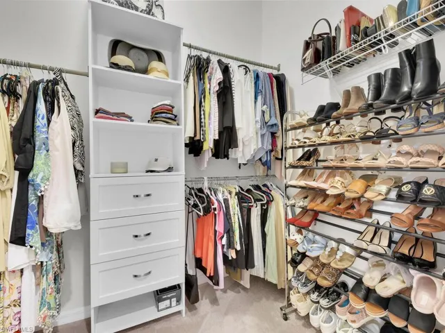 Primary bedroom custom walk-in closet #1