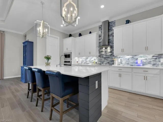 Open Kitchen with Quartz countertops and custom back-splash