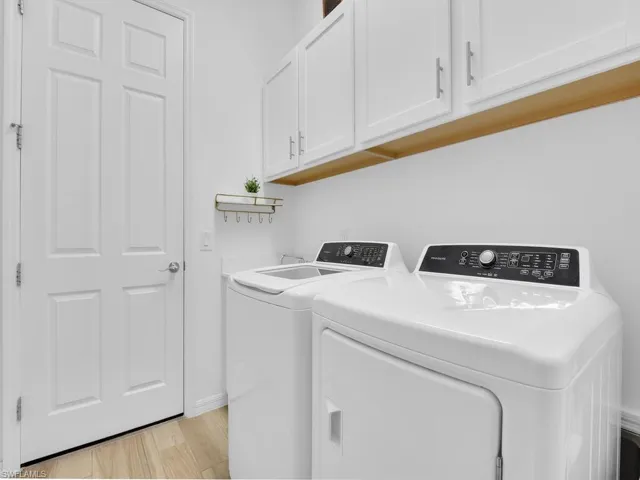 Laundry Room with sink (located on the left side of washing machine)