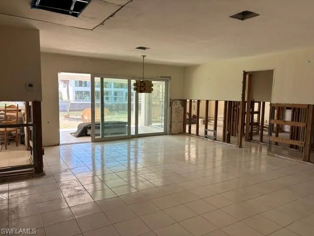 Spare room with tile patterned flooring