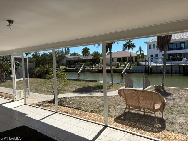 Sunroom with a water view
