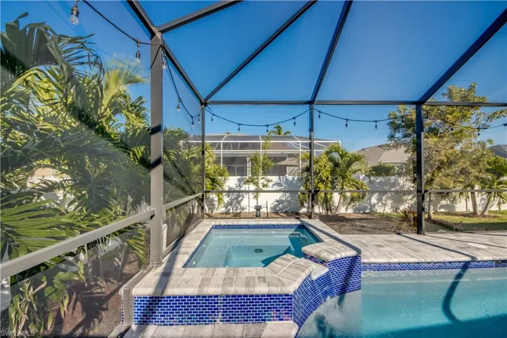View of swimming pool an in ground hot tub