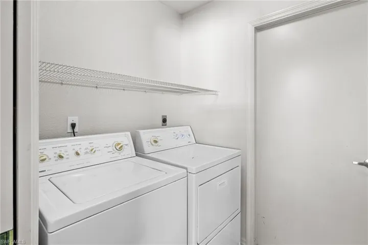 Laundry area featuring washer and clothes dryer
