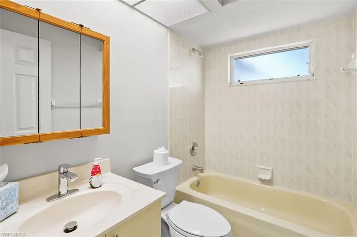 Full bath featuring vanity and bathtub / shower combination