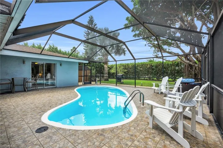 Spacious enclosed lanai with heated salt water pool.