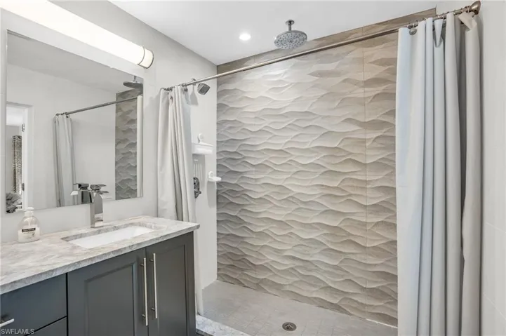 Master bath with large walk in shower and dual sink vanity