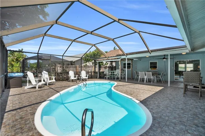 Large enclosed Lanai with heated pool and covered seating/dining/entertaining space