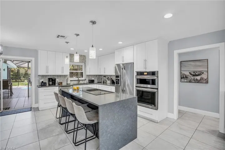 Bright and open concept kitchen/dining area! Beautifully updated!! Great space to entertain with easy access to outside!!