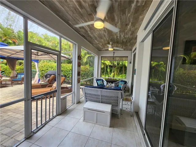 Tiled lanai and planked ceiling