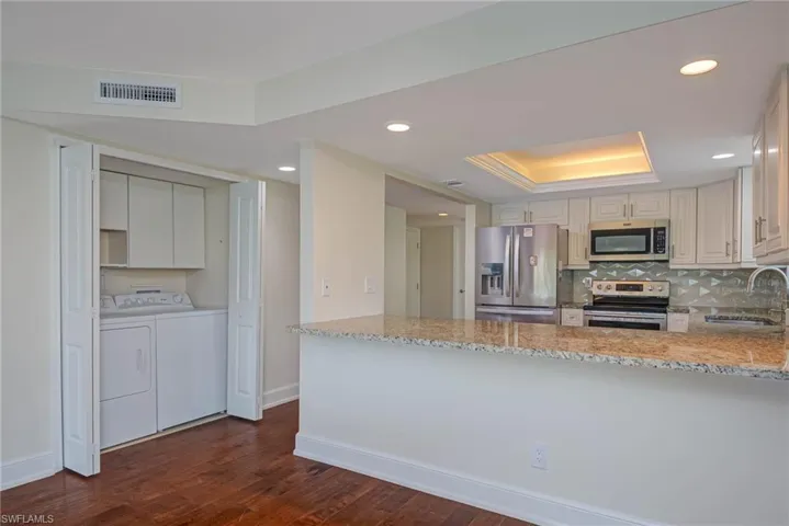 View of laundry & kitchen