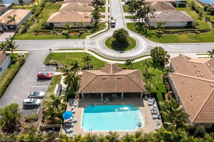 Aerial perspective of suburban area with a pool area