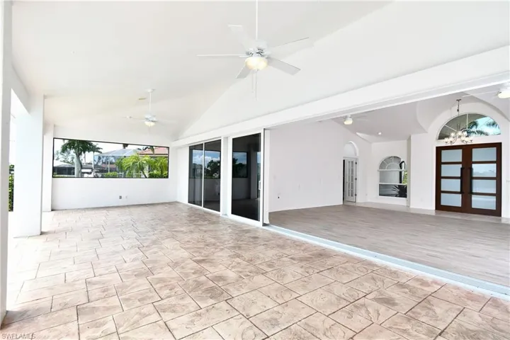 View of patio / terrace with french doors and ceiling fan