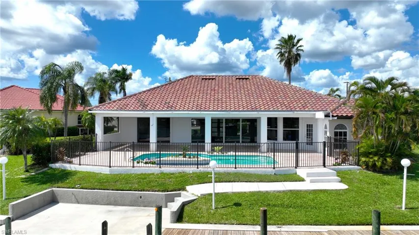 View of swimming pool with a yard and a patio area