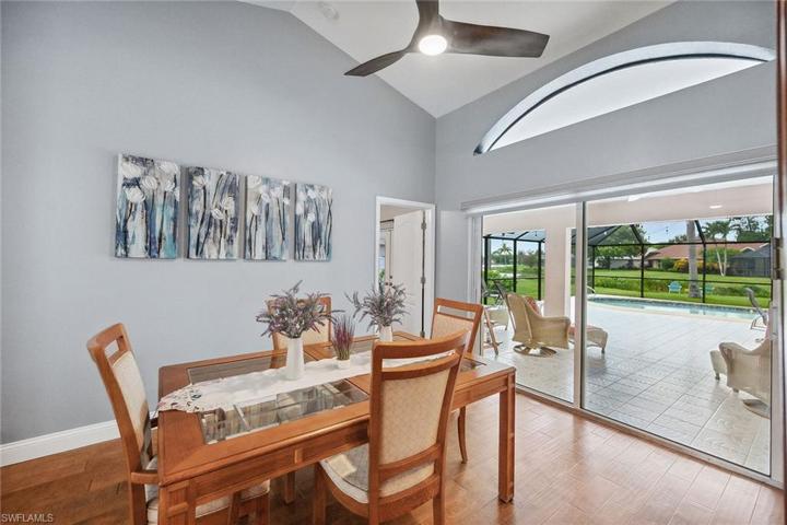 Formal dining room with new sliders leading to lanai and pool!