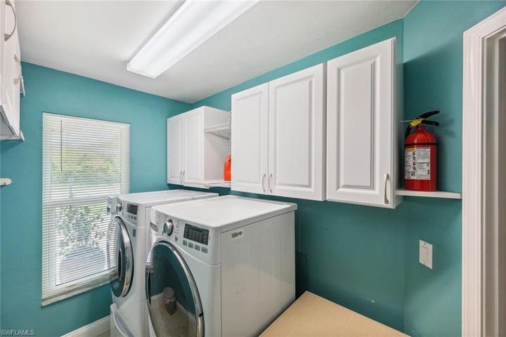 Top of line washer/dryer with pedestals. Plenty of cabinets too!