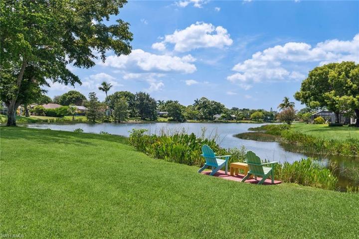 What a beautiful LAKE VIEW! Relax in your backyard chairs!