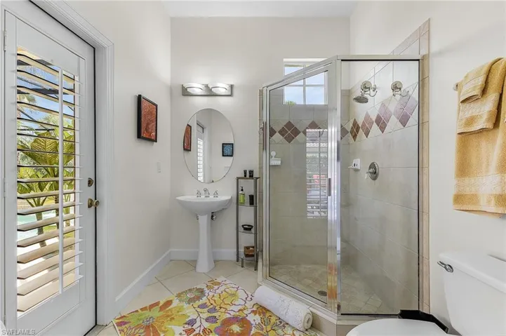 Bathroom leading to lanai and pool