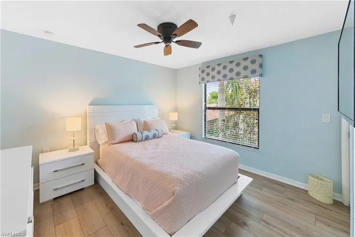 Bedroom featuring ceiling fan and light hardwood / wood-style flooring