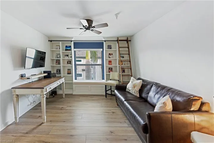 Office with ceiling fan and light wood-type flooring