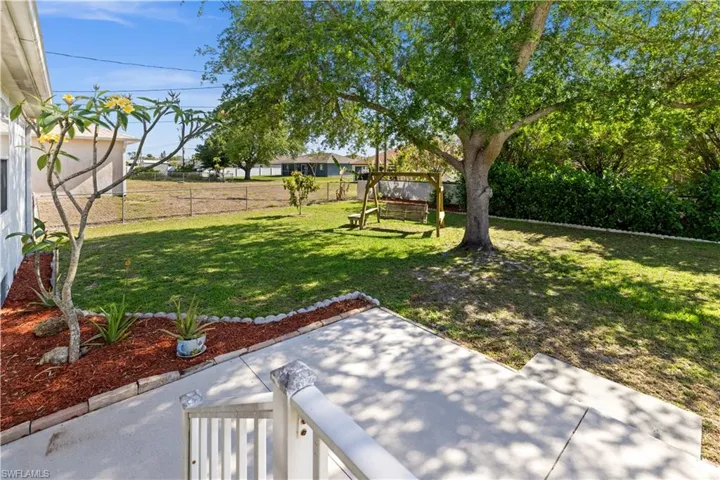 Fenced backyard featuring a patio