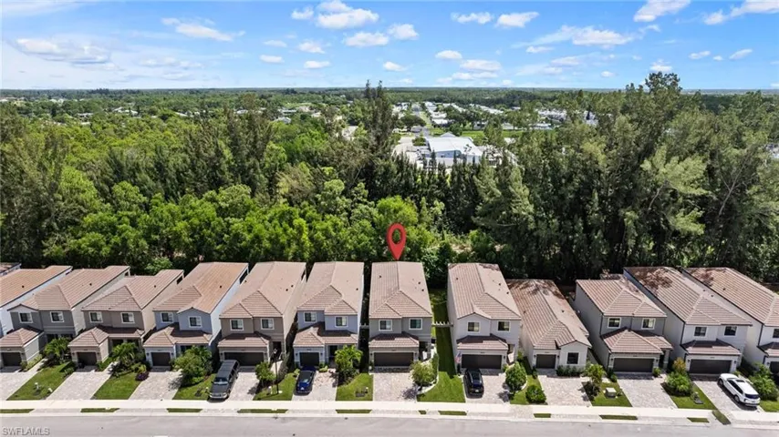 Aerial view featuring a view of the wooded preserve