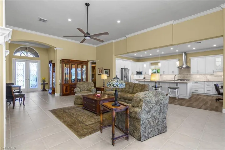 Open great room and newly renovated kitchen...the original wall between the kitchen and dining room has been eliminated for ambience, function and livability. An absolutely stunning change!!