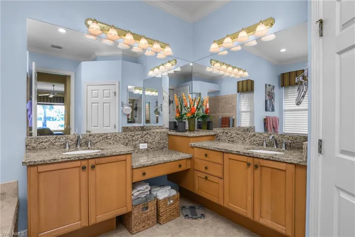 Master bath with dual sinks and vanity.