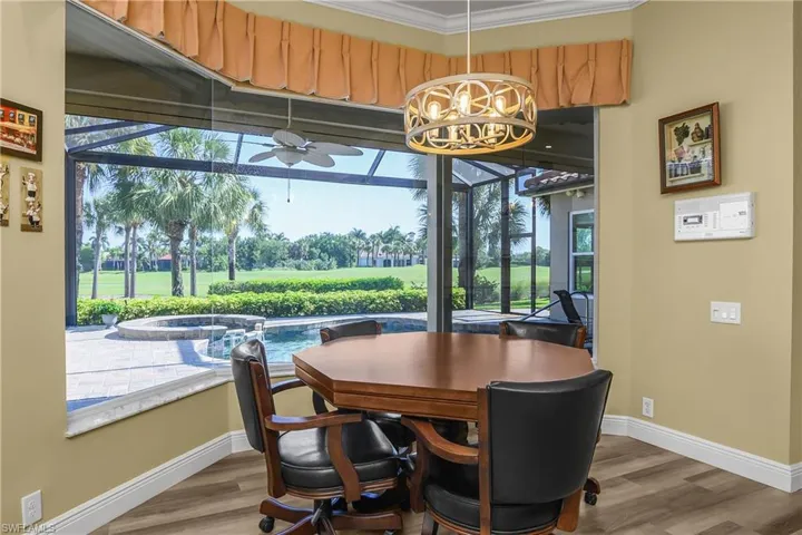 Close up of dining area, note picture window screen on lanai for full view of fairway and lake beyond.