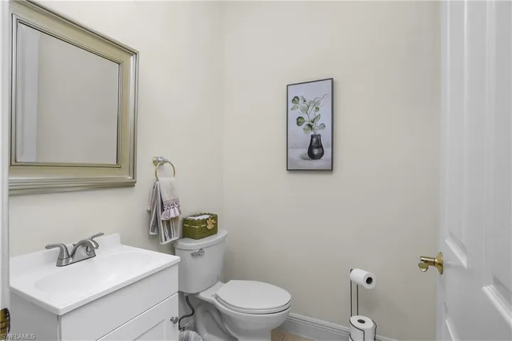 Half bath adjacent to den