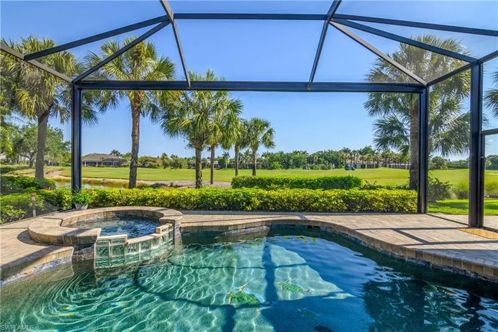 Natural gas heated beautifully refinished pool and spa on paver stone lanai with "picture window" screen showcasing fairway #6 of south course. Pool, spa and 'backyard' sun drenched.
