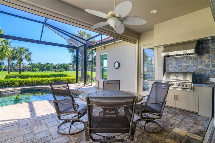 Natural gas grill with ventilated hood, beautifully paved deck. Door leads to master bedroom.