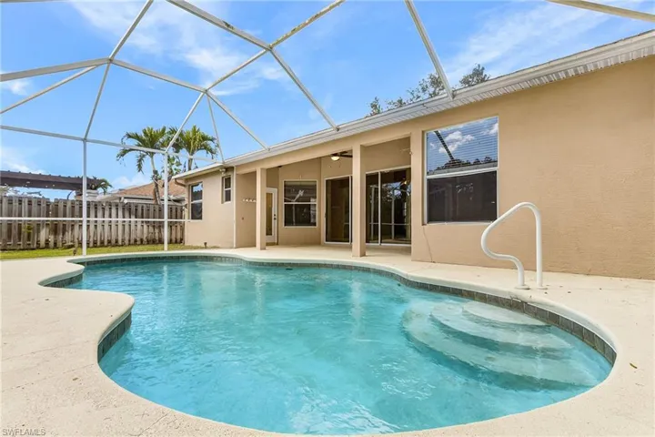 View of pool with a sunroom, a lanai, and patio surround