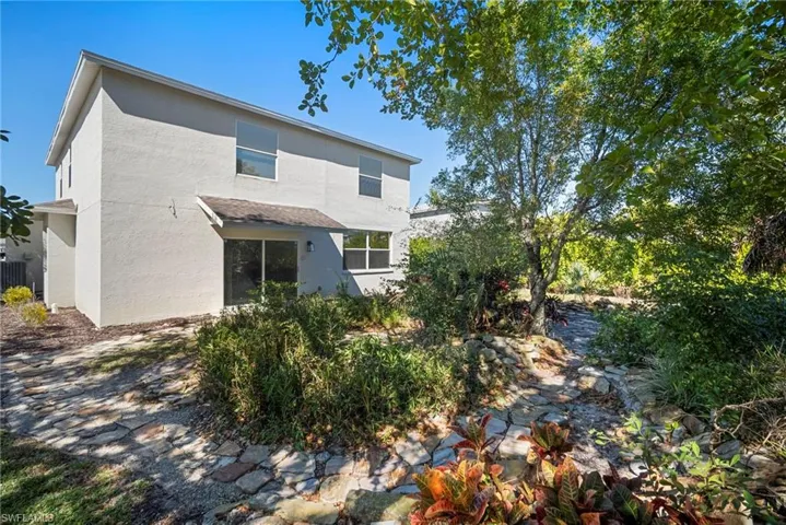 Rear view of house with stucco siding