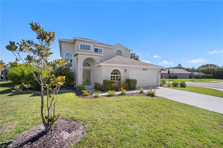 Mediterranean / spanish home featuring stucco siding, a front yard, concrete driveway, and a garage